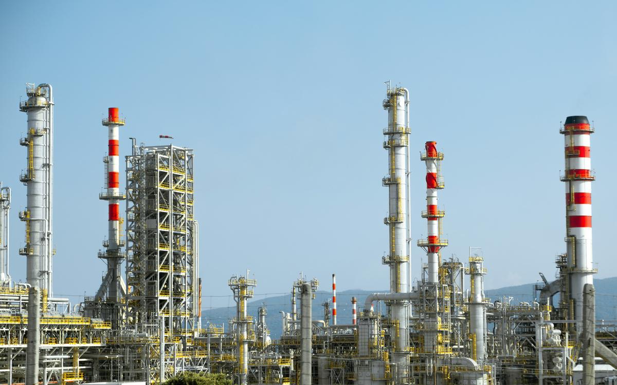 Process plant with columns and pipework at an industrial facility