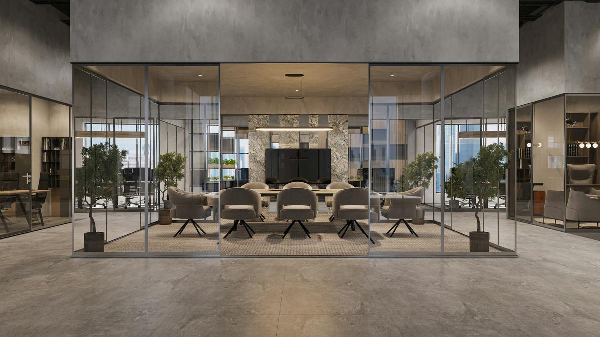 Glass-walled meeting room with a conference table in a modern office