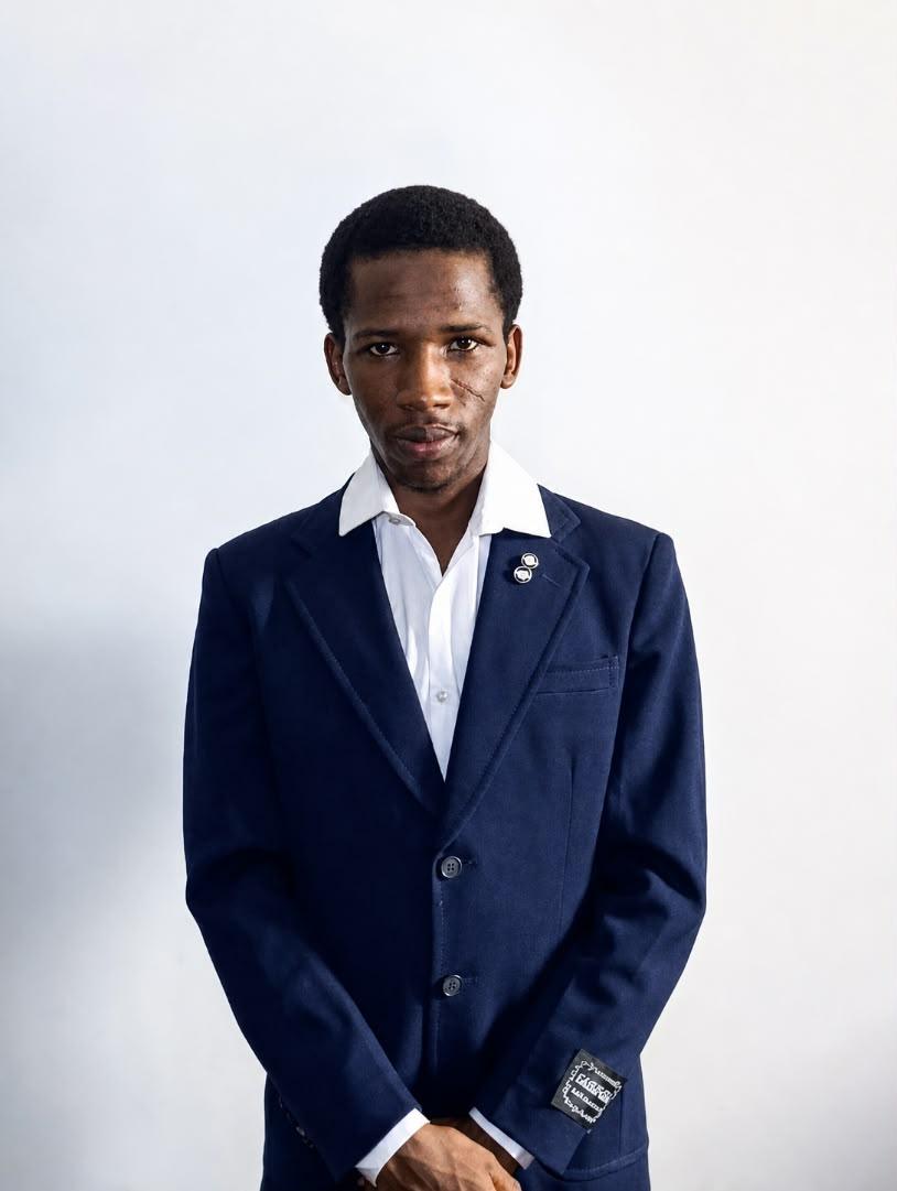 Portrait of Ahmad Isah Audi, Managing Director and CEO of GBAAC Construction Company Ltd, wearing a navy suit